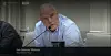 Jan Gunnar Madsen sitter ved et panelbord og snakker i en mikrofon under en høring.